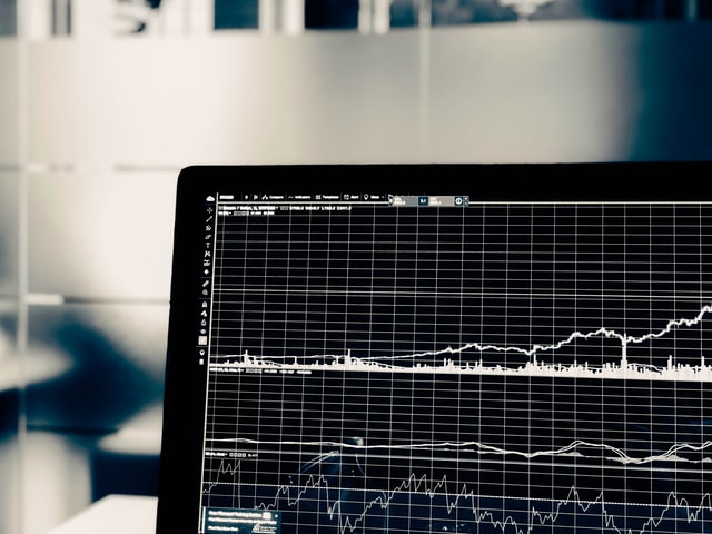 Laptop with screen showing in a graph, price changes on a trading platform